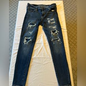 Skinny AE Dark denim jeans. Distressed but no show.
